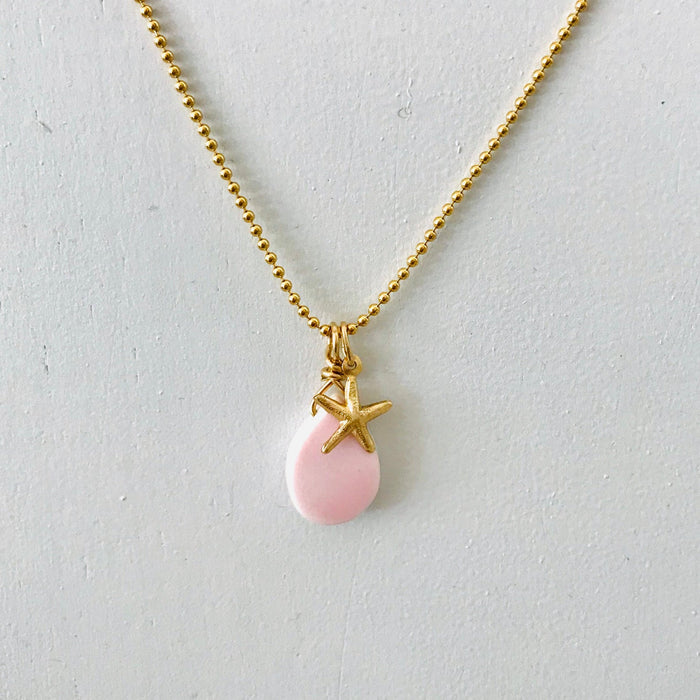 Starfish & Conch Shell Charm necklace by ZEN by Karen Moore on white background