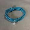 Wise Up To Love Eco Zen Wrap Jewelry by ZEN by Karen Moore with blue strap on teal & gold background