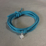Wise Up To Love Eco Zen Wrap Jewelry by ZEN by Karen Moore with blue strap on teal & gold background
