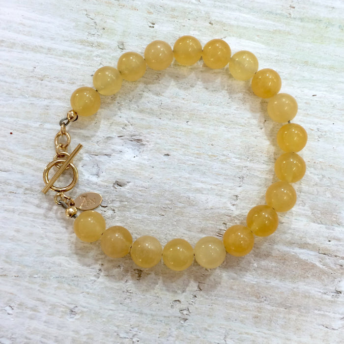 Calcite I Am Positive gemstone bracelet by ZEN by Karen Moore on white wood