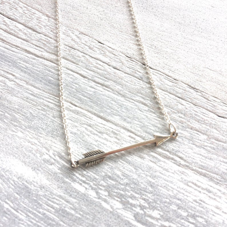 You're Going The Right Way Arrow Necklace in silver by ZEN by Karen Moore on white wood