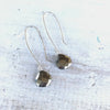 Magnificent Manifestor pyrite earrings in sterling silver by ZEN by Karen Moore alternate view on white wood