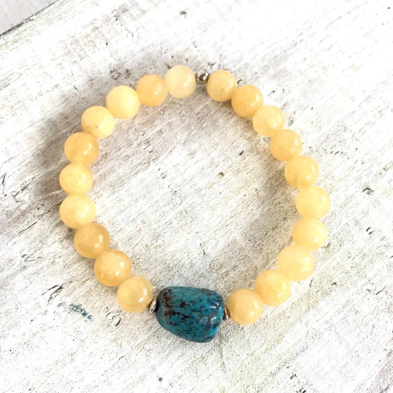 Calcite & turquoise Sunshine Turquoise Bracelet by ZEN by Karen Moore overhead view  on white wood