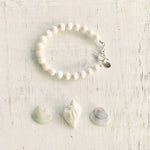 Purely Conch Bracelet by ZEN by Karen Moore jewelry with three seashells on white wood