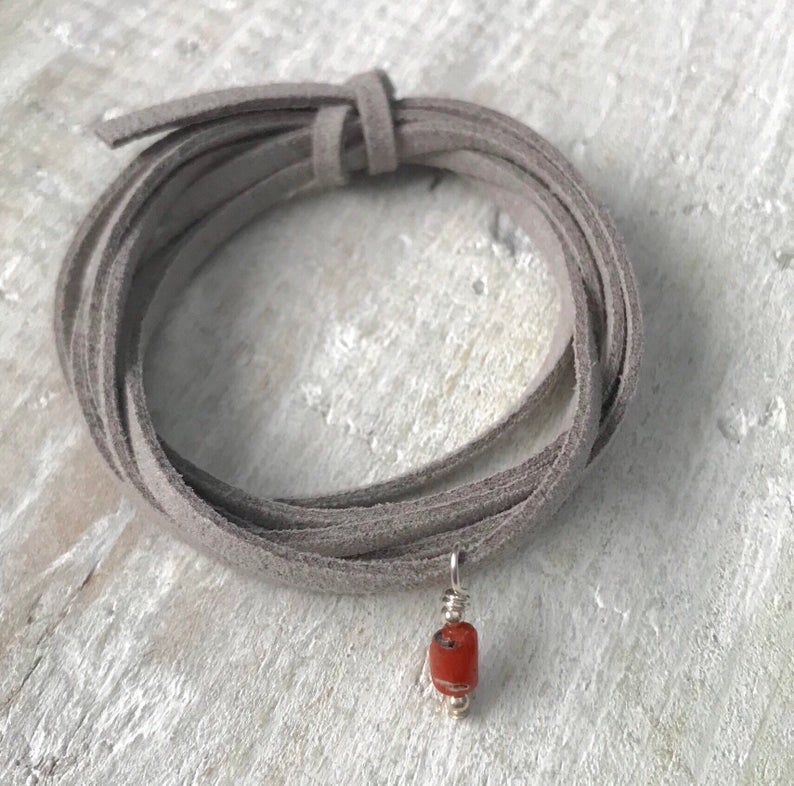 Life Of The Sea Coral Eco Zen Wrap Jewelry by ZEN by Karen Moore close up on white wood