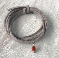 Life Of The Sea Coral Eco Zen Wrap Jewelry by ZEN by Karen Moore close up on white wood