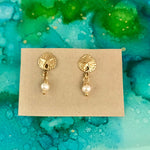 Pearl ZEN Mini Earrings by ZEN by Karen Moore featuring sand dollar pearl earrings on blue/green splatter background