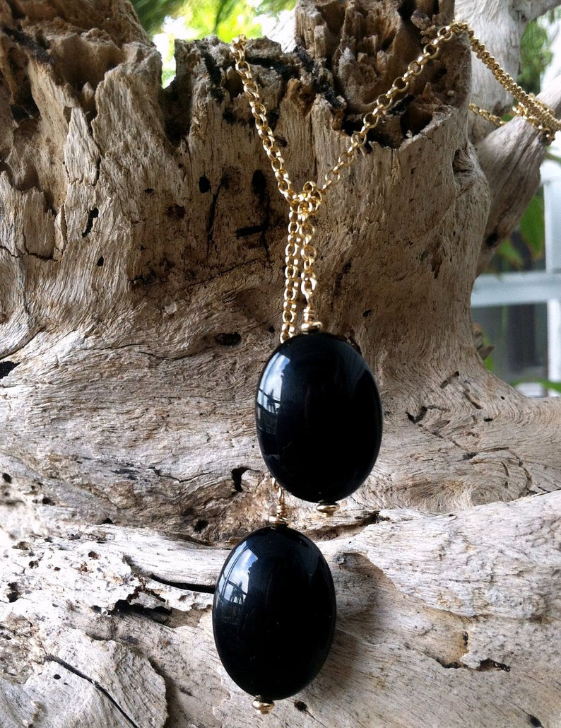 Be Grounded Agate Zen Wrap Necklace by ZEN by Karen Moore hanging on driftwood on driftwood