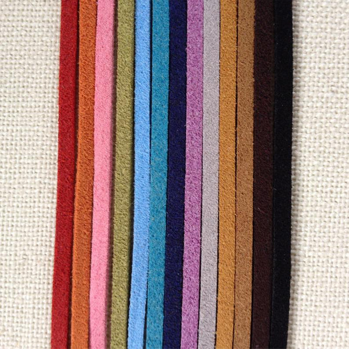 Rainbow of Eco ZEN Wrap jewelry suede bands by ZEN by Karen Moore on cream cloth