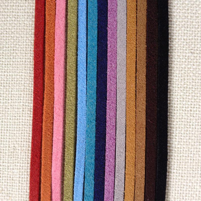 Rainbow of Eco ZEN Wrap jewelry suede bands on cream cloth