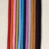 Rainbow of Eco ZEN Wrap jewelry suede bands by ZEN by Karen Moore on cream cloth