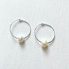 Circle of Wisdom Pearl Hoop Earrings sterling silver on white background