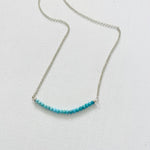 Turquoise Smile Necklace by ZEN by Karen Moore  on white background