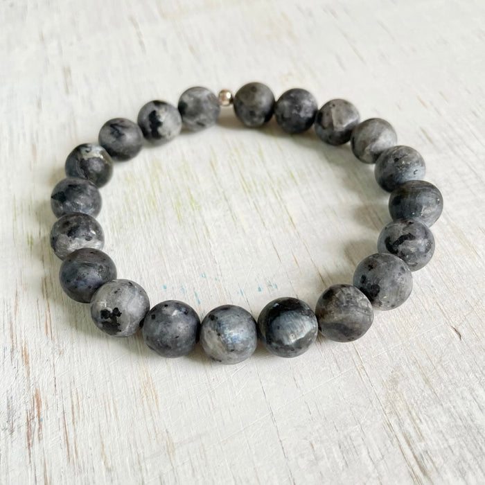Patient Protector Larvakite Menz ZEN Bracelet by ZEN by Karen Moore on white wood