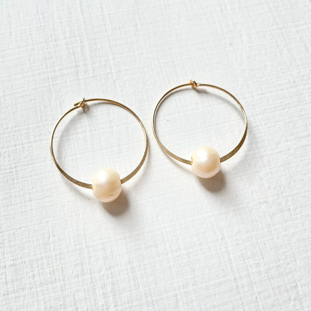 Circle of Wisdom Pearl Hoop Earrings 14kt gold on white background