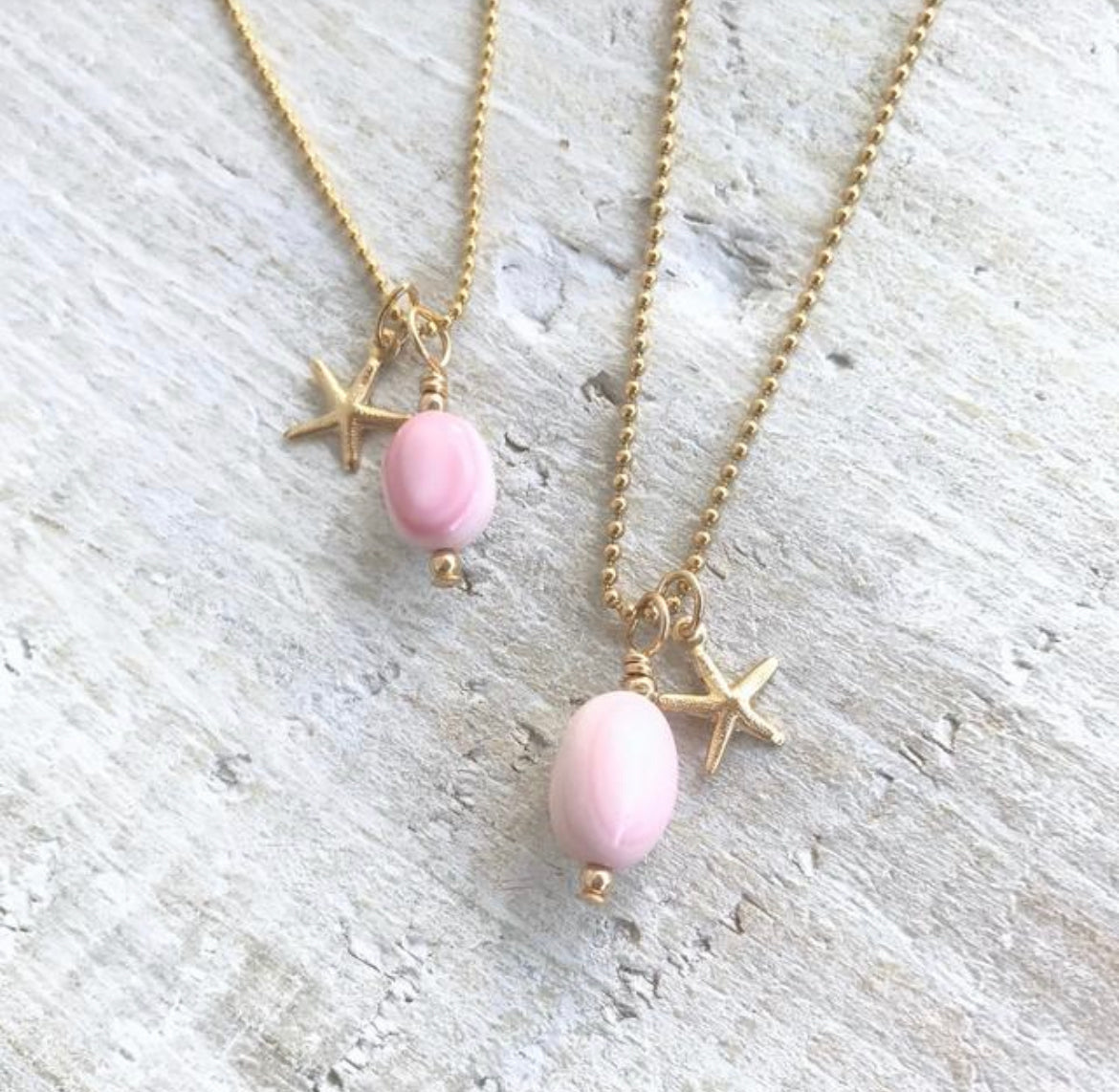 Star of the Ocean Conch Shell Charm Necklace by ZEN by Karen Moore on white wood
