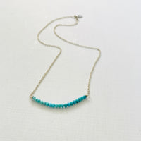 Turquoise Smile Necklace by ZEN by Karen Moore zoomed out view on white background