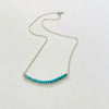 Turquoise Smile Necklace by ZEN by Karen Moore zoomed out view on white background