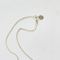 Turquoise Smile Necklace by ZEN by Karen Moore clasp on white background